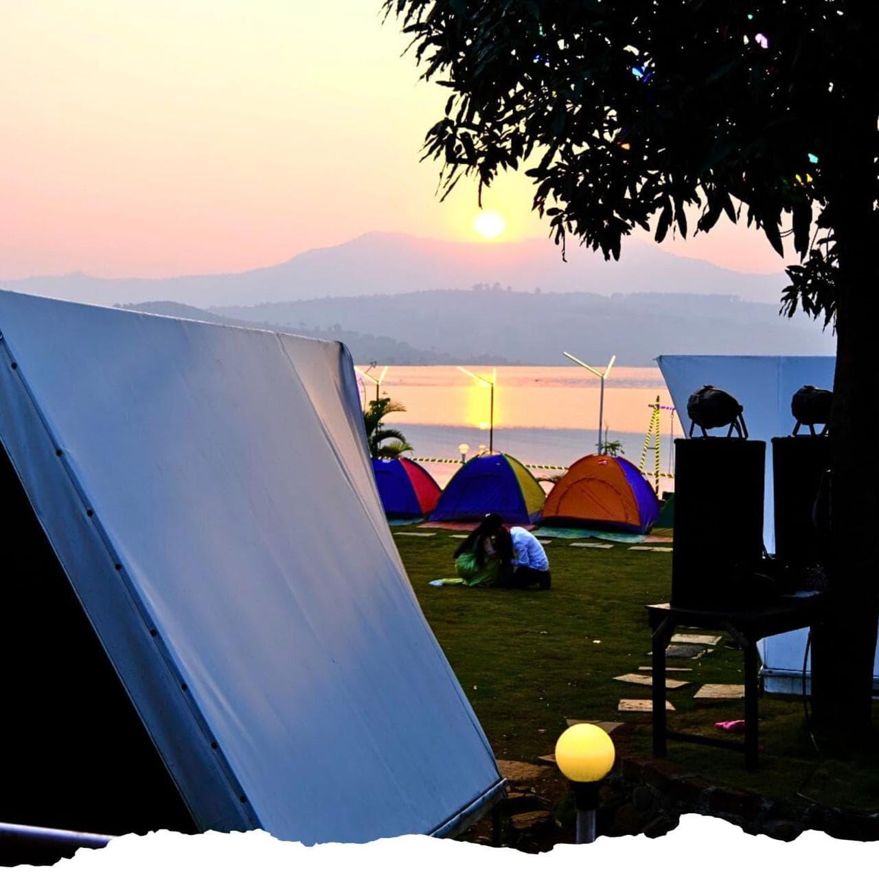 Triangle tents overlooking Pawna Lake at Eagle Paradise Camping