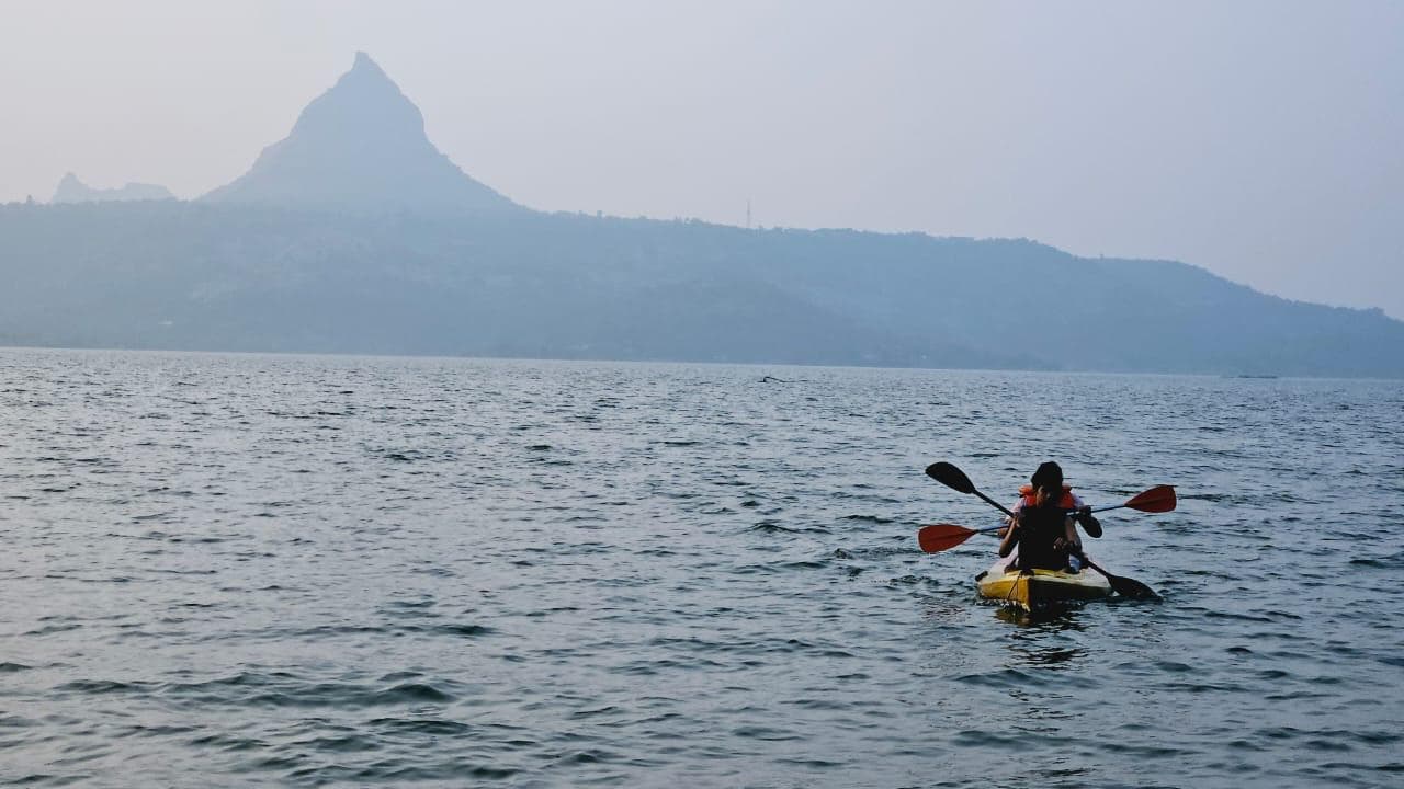 Kayaking activity beside a Pawna Lake campsite